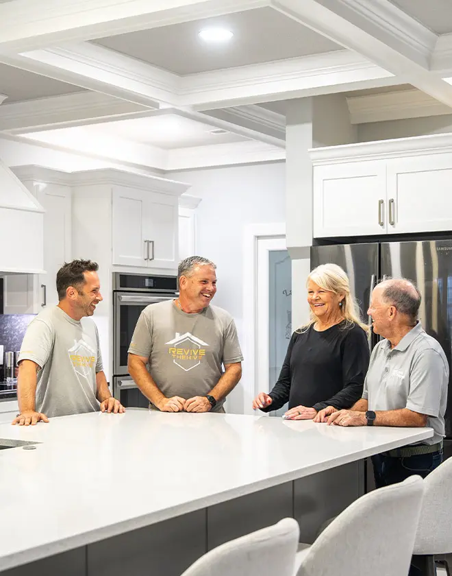 4 people talking in a luxury kitchen